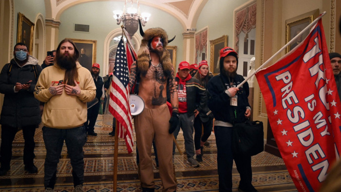 Supporters of Donald Trump enter the US Capitol on January 6 2021, in Washington