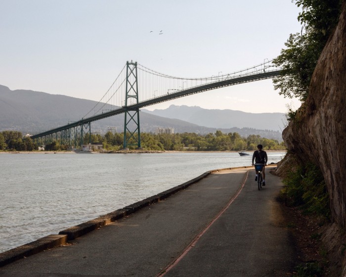 Stanley Park Seawall, with the bay and Lions Gate suspension bridge in the background