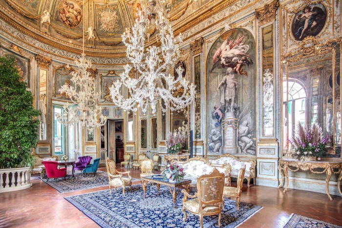 opulent apartment with chandelier, frescoes and gilded furniture