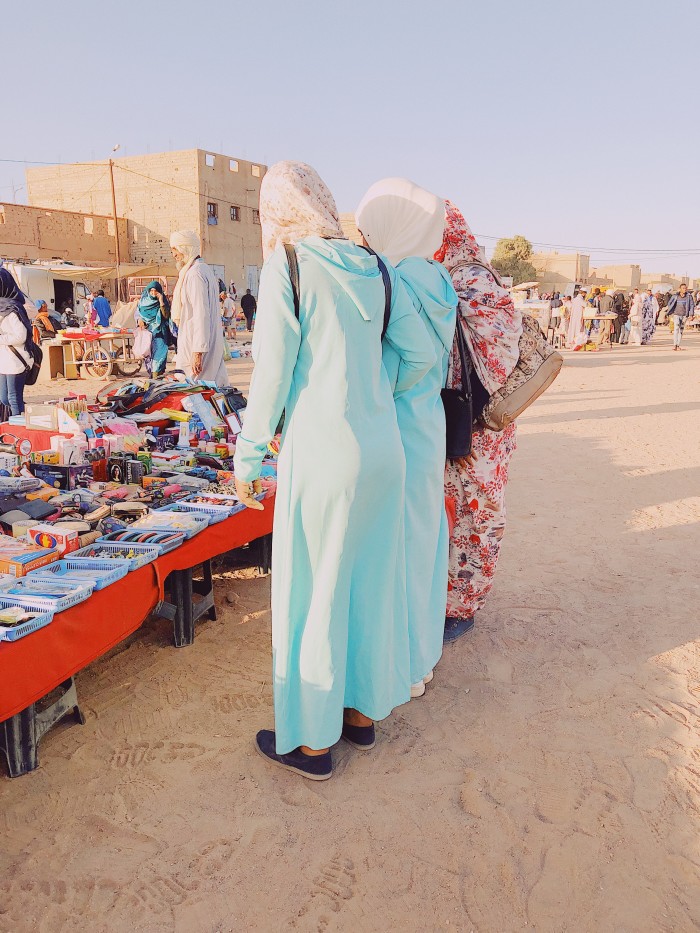 Shoppers at a market stall in Marrakesh