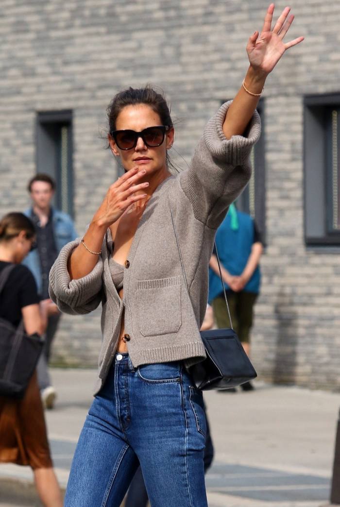 Katie Holmes wearing a Khaite cashmere cardigan and bra in New York