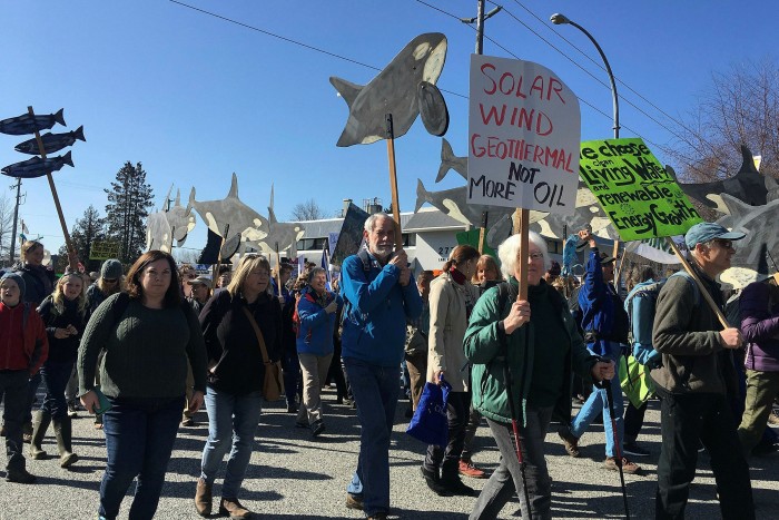 Activists rally against the expansion of an oil pipeline by Kinder Morgan in Canada