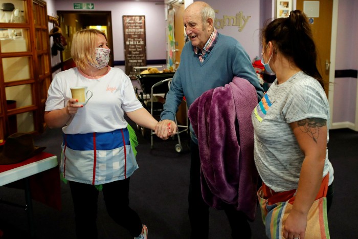 A resident at a Nottinghamshire nursing home is helped by staff