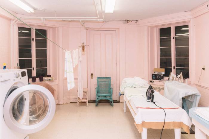A pink laundry room in one of Newport’s seaside homes