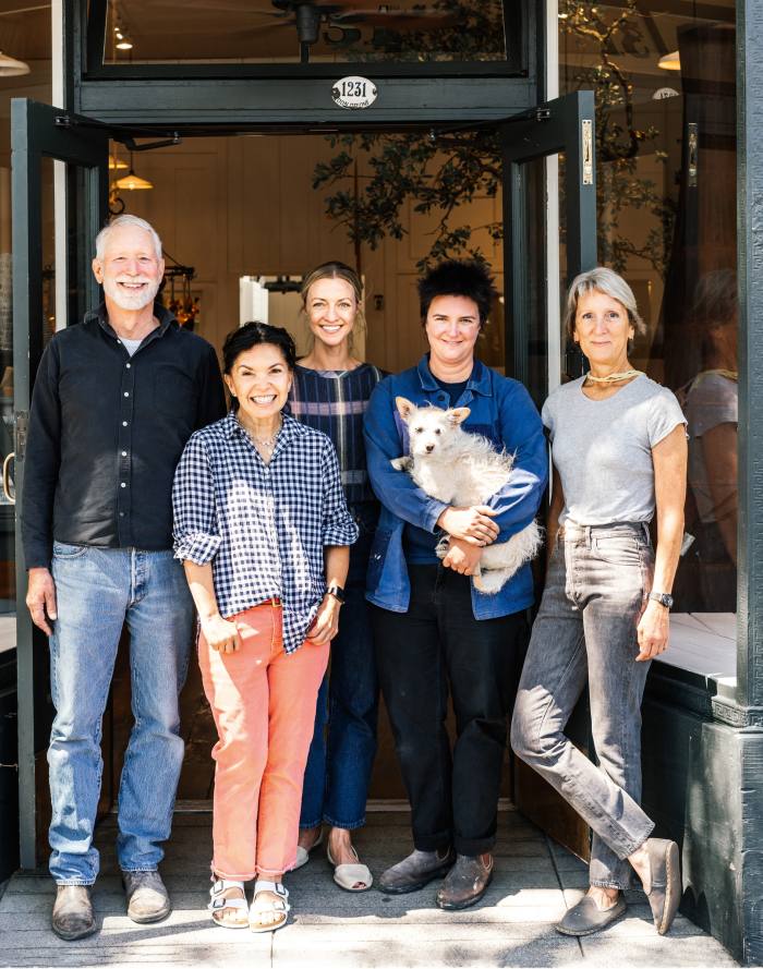 From left, owner Richard Carter, Michelle Neal, Erin Radcliffe, Chelsea Radcliffe with dog Oliver, and Toby Hanson