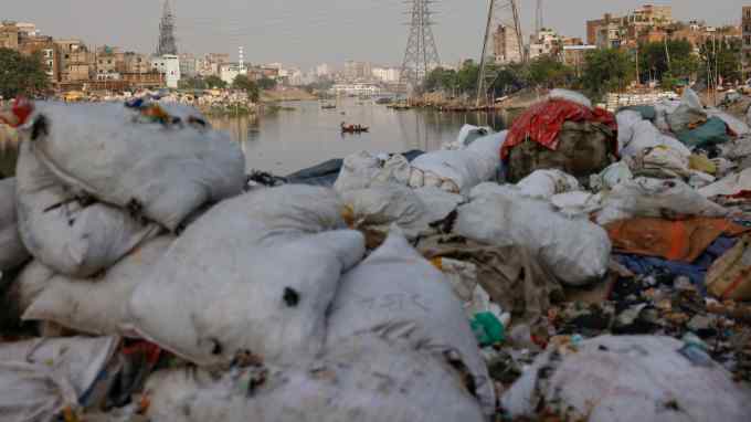 Plastic waste piles up on the bank of the Buriganga River in Dhaka, Bangladesh on April 21.