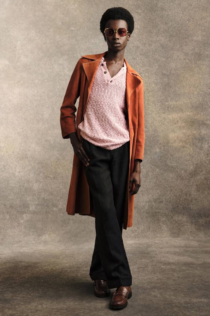 Emmanuel wears Wales Bonner suede trench and linen trousers, both POA. Salvatore Ferragamo knitted cotton polo shirt, £630. GH Bass leather Weejuns Larson penny loafers, £150. Gucci acetate sunglasses, £330. Socks and earring, stylist’s own