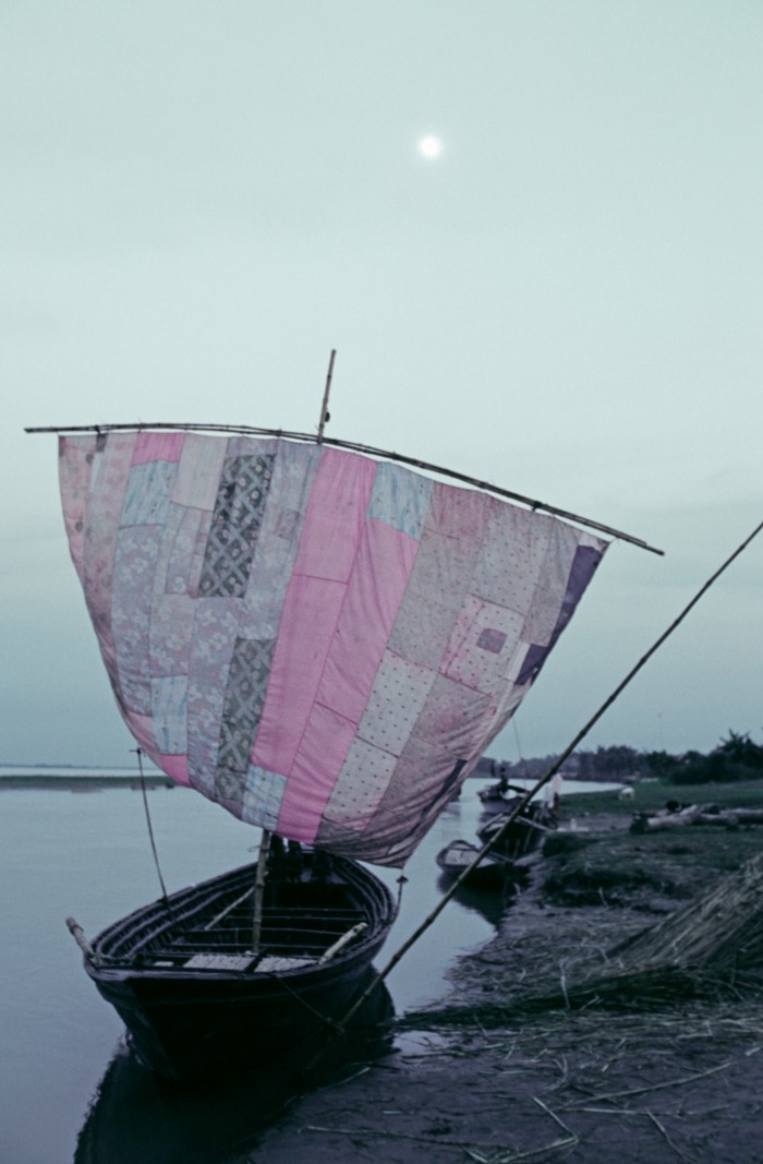 Boat with a patchwork sail on the Jamuna River, Bangladesh