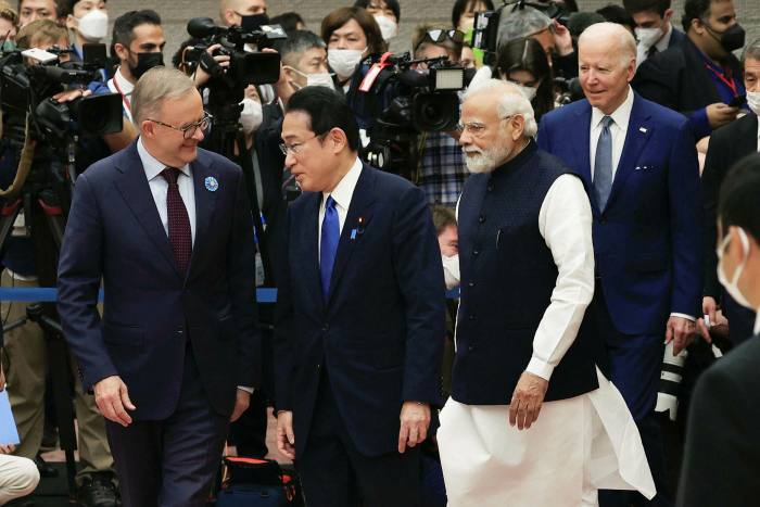 President Biden stands behind Anthony Albanese of Australia, Fumio Kishida of Japan and Narendra Modi of India 