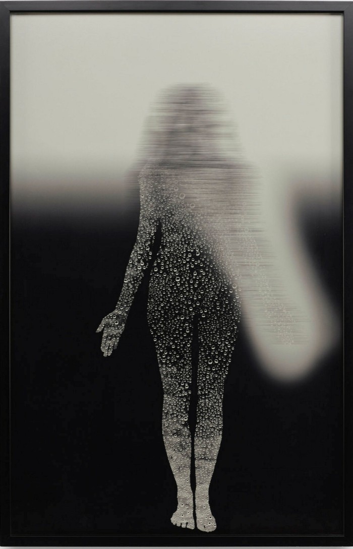 Greyscale picture of a woman seemingly made from drops of water