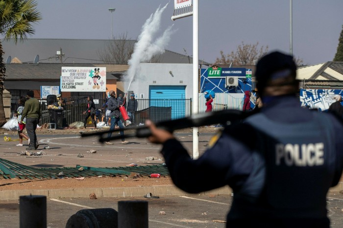 Police outside Letsoho mall in Katlehong, near Johannesburg, on Monday