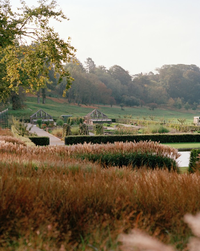 A view across the gardens to ancient woodland