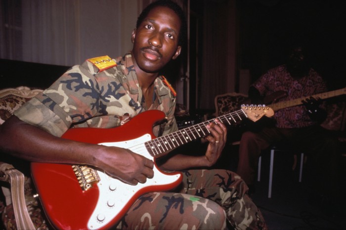 The former leader of Burkina Faso playing an electric guitar 