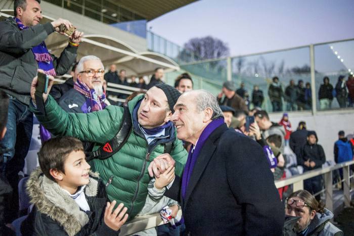 Commisso posing for selfies with fans