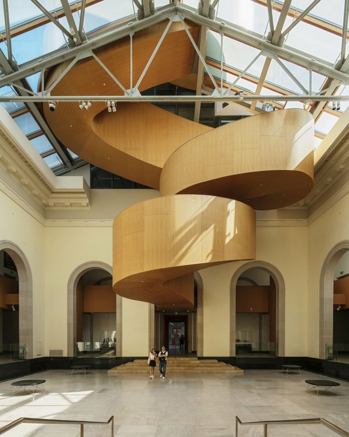Blond-wood spiral staircases in one of the museum’s galleries