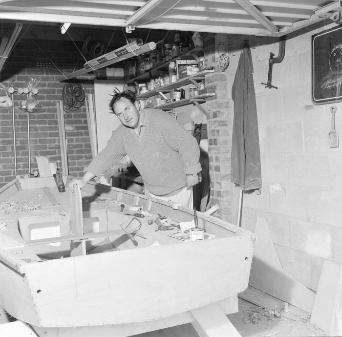 A Mirror dinghy-builder at work in his garage in the 1960s