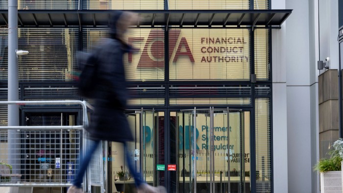 People walk past Financial Conduct Authority’s offices in Stratford