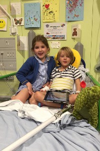 Alfie with his sister Violet on Koala ward at Great Ormond Street before Alfie’s surgery