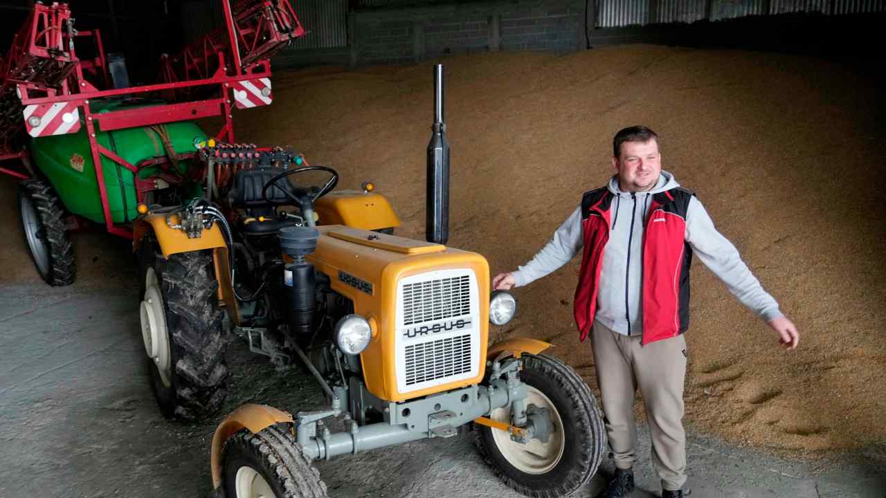 A Polish farmer and his tractor