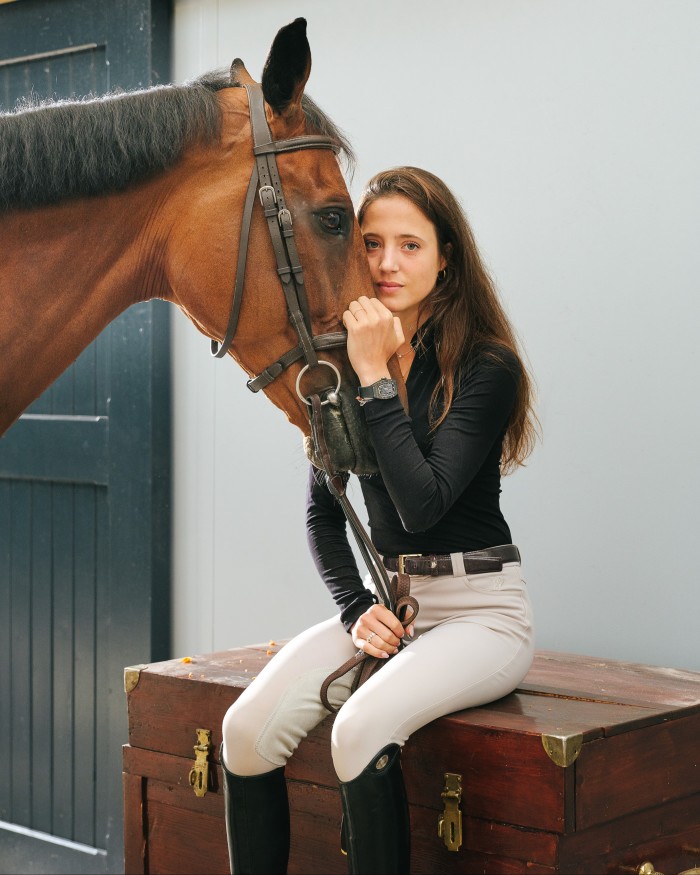 Flore Giraud with her horse at Haras de Lécaude. A Richard Mille ambassador, she wears a RM 07-01 carbon TPT and titanium watch
