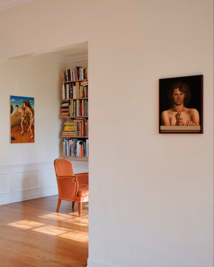Delicate paintings of naked men installed on the white walls of someone’s living room