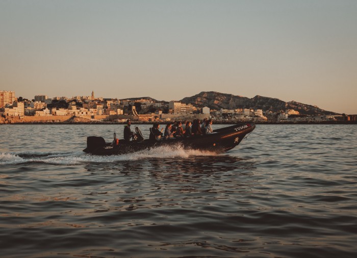 The boat heads out of Marseille into open water