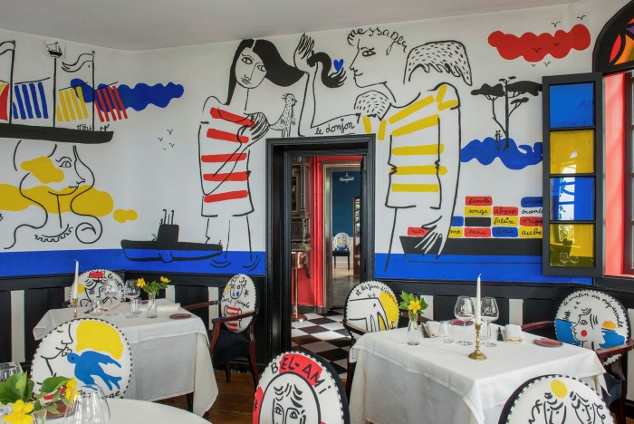 Frescoes by fashion designer Jean-Charles de Castelbajac cover the walls at Michelin-starred Le Donjon – Domaine Saint Clair