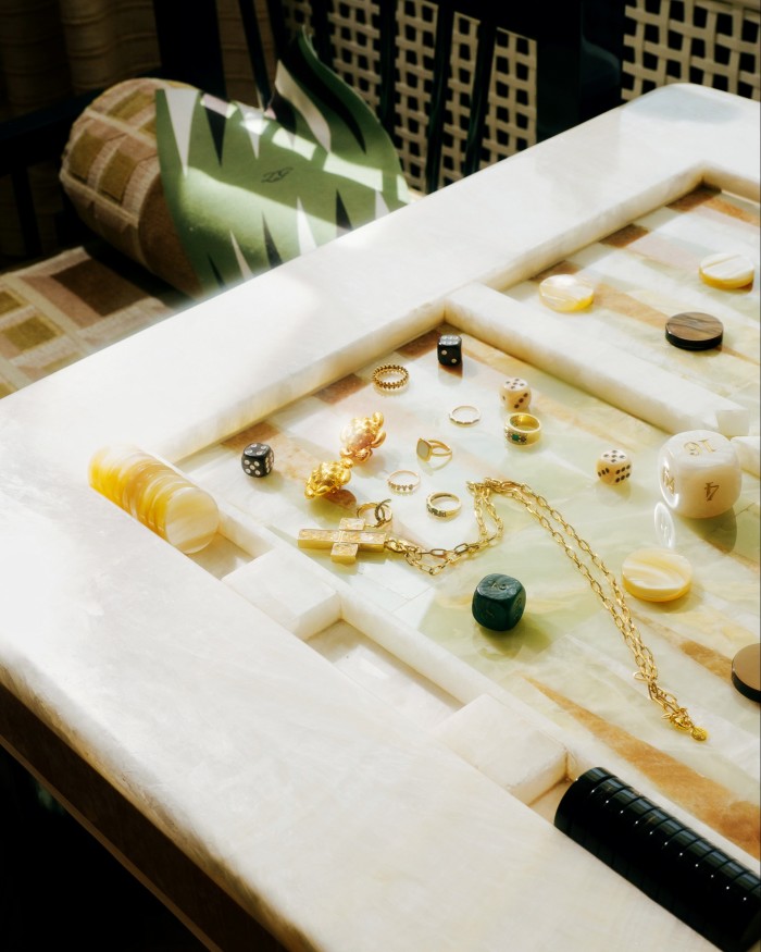 Assorted jewellery on a backgammon table