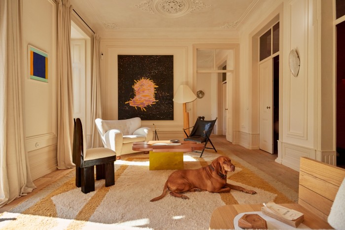 Kim’s Ionic coffee table and Ionic floor lamp. On the wall hangs Untitled, 2022, by Pedro Batista
