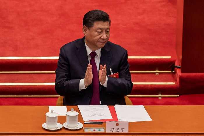 Xi Jinping applauds after the result of the vote on changes to Hong Kong’s election system was announced in Beijing in March