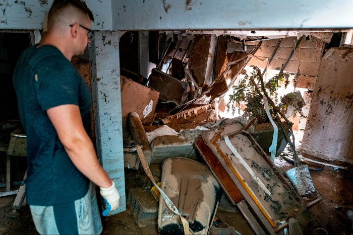 Simon Wolyniec stands in the basement of his Manville home and looks at the damage caused  in the wake of Hurricane Ida