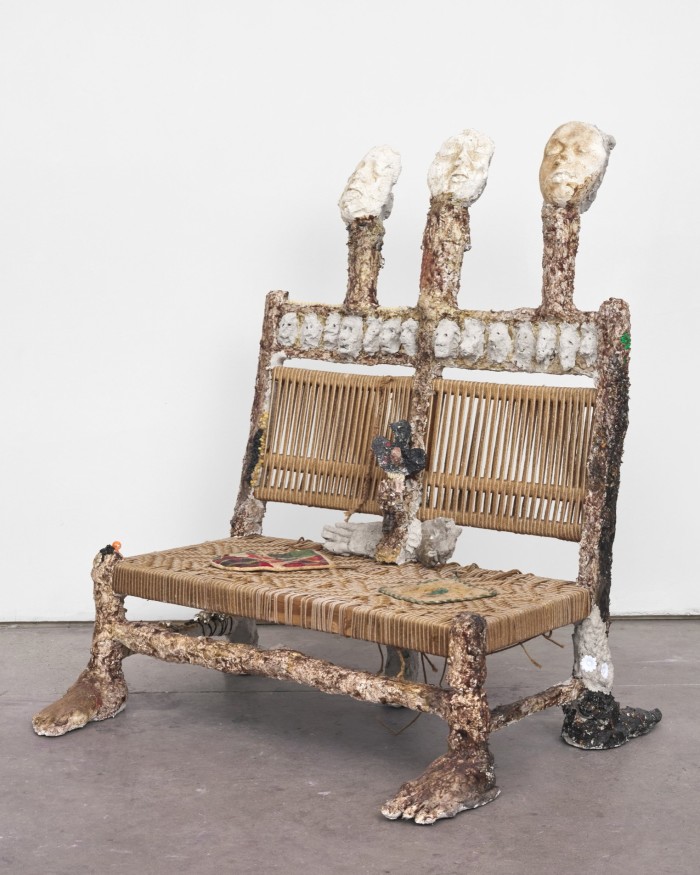 Woven bench with ceramic feet and heads