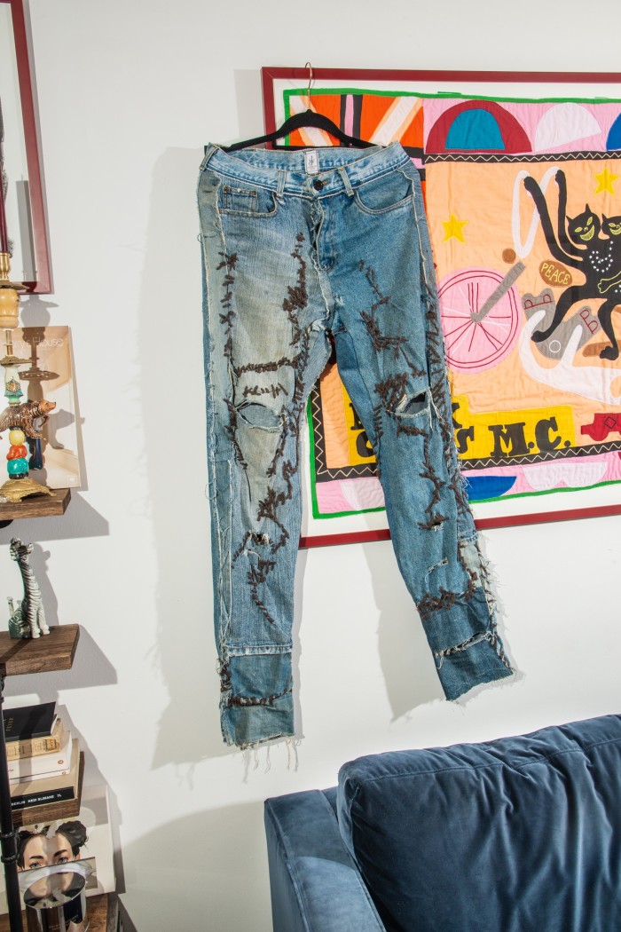 JW Anderson reconstructed jeans hang from Gay Black Cats MC, by Grayson Perry