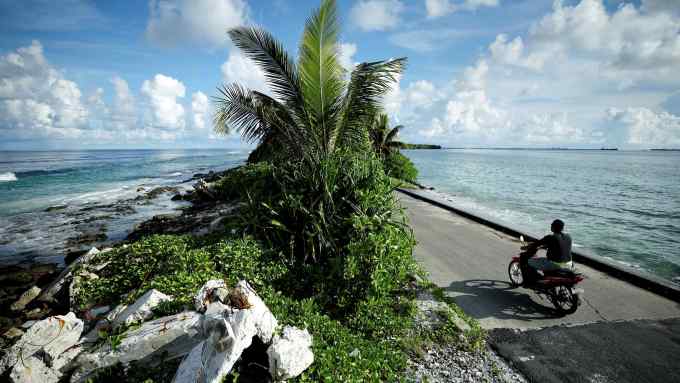 A motorbike drives over a low lying causeway on the Pacific island of Tuvalu which is at risk from rising sea levels. Melissa Zhang’s proposal is for ‘Trailblazers’, a climate-focused business book telling the stories of seven women leaders tackling decarbonisation