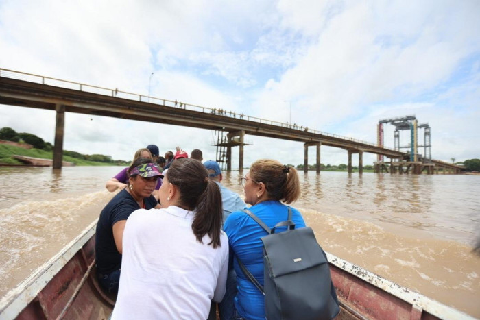 María Corina Machado travelling around Venezuela’s interior with companions in a canoe