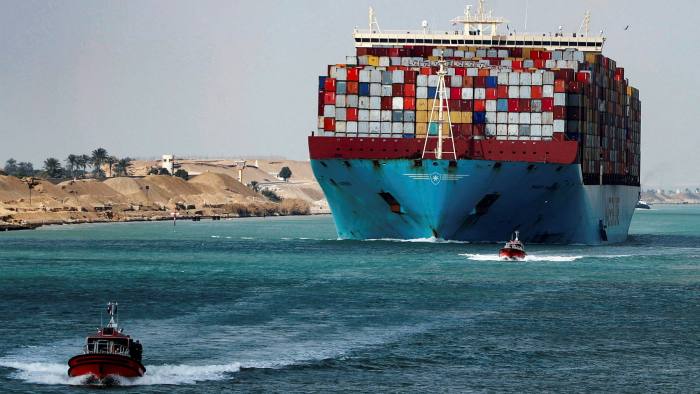 A shipping container passes through the Suez Canal