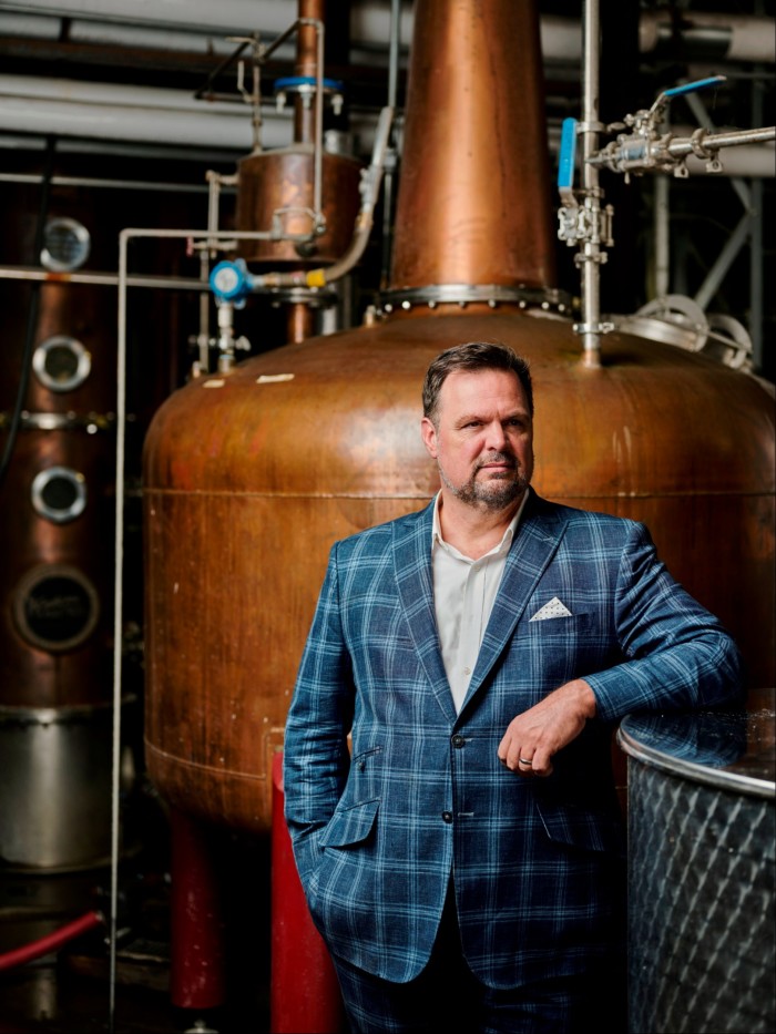 Property developer Darek Bell poses for a portrait at his distillery