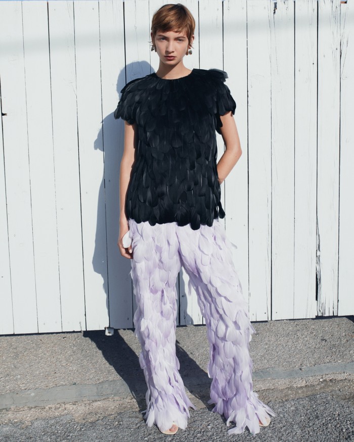 Rolf wears Loewe feather top, £7,400, feather trousers, POA, and leather sandals, £1,300