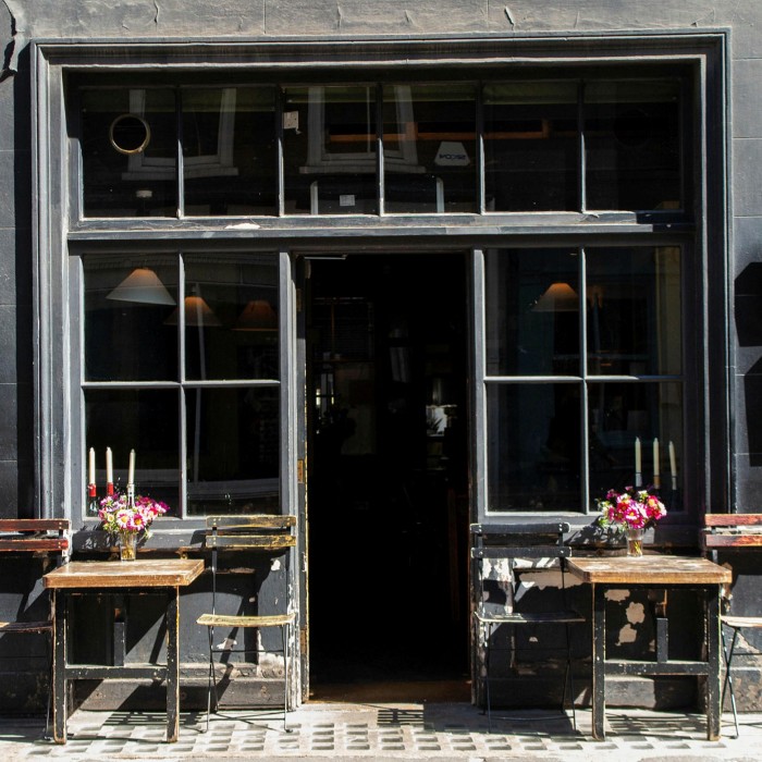 Two small pavement tables constitute the restaurant’s al fresco options – but the real fun is happening inside