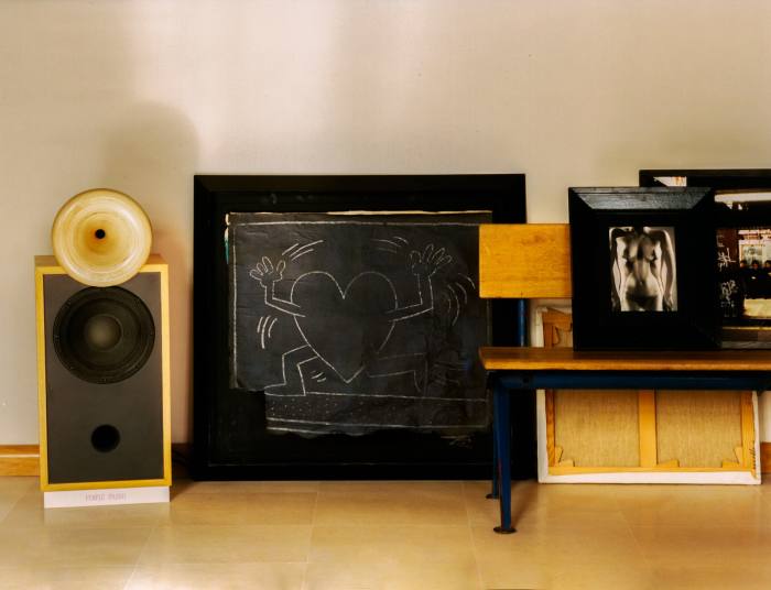 Artworks by (from left) Keith Haring, Man Ray and Jon Naar surround the Jean Prouvé bench
