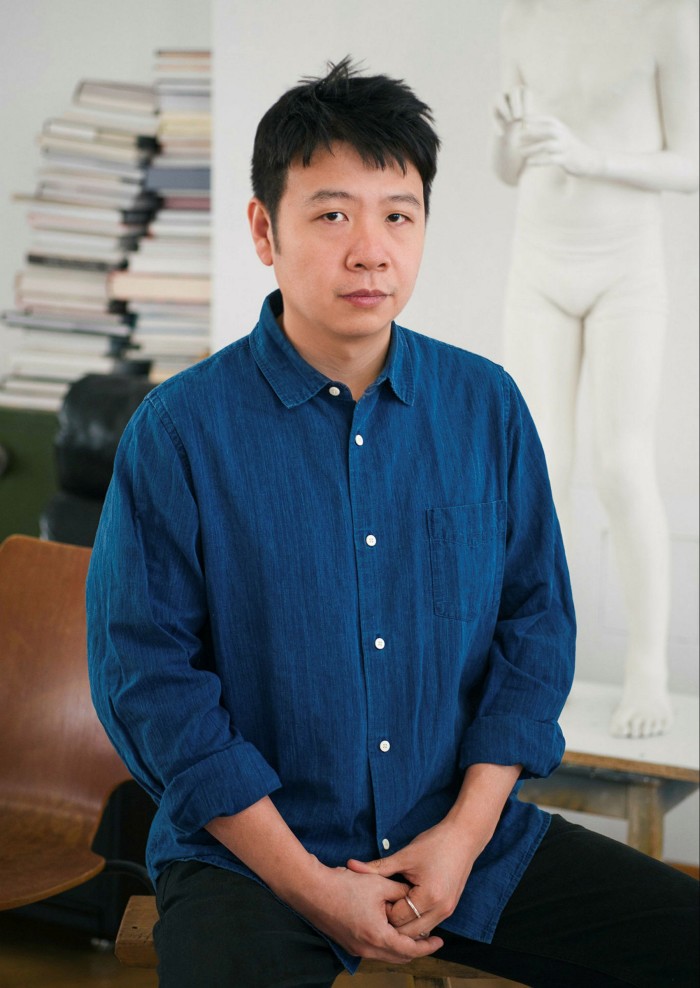 He Xiangyu in his studio with artwork for the exhibition at Studio Berlin