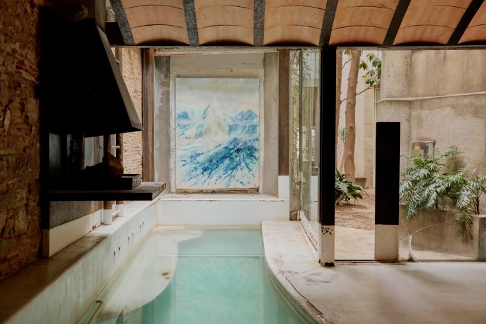 The swimming pool at Tagliabue’s home, created in collaboration with architect Gustavo Barba – the artwork is by British artist Alex Duncan