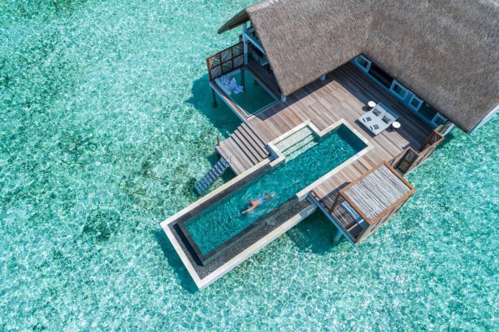 A seaside swimming pool at the Four Seasons Resort Maldives