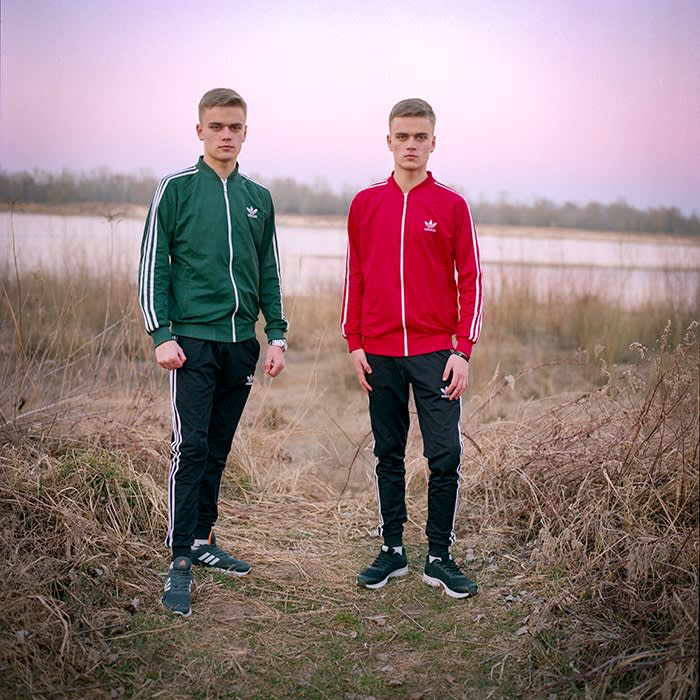 Vitalii and Vadym standing in a field
