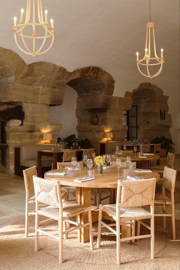 The hotel restaurant with exposed stone walls