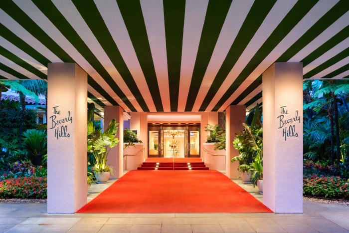 Red carpet stretches from the entrance through the main lobby at The Beverly Hills Hotel, California