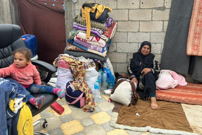 Om Mohamed Doghmosh  and her family are camped at a hospital construction site in Rafah