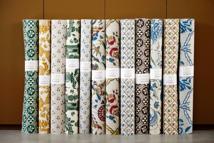 Rolls of printed wallpaper in the boutique