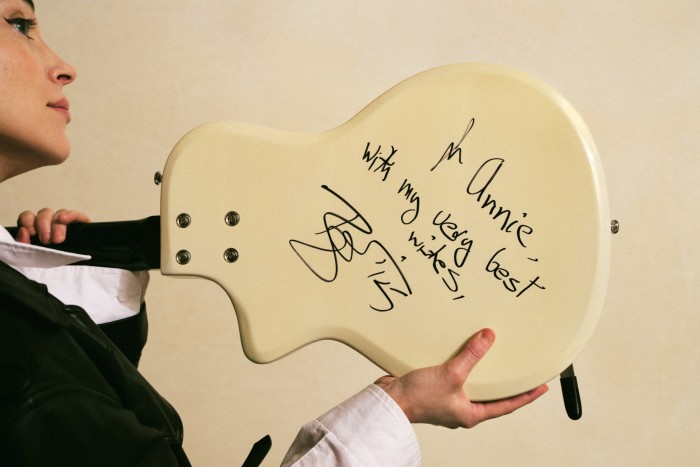 Her Supro Dual Tone guitar signed by David Bowie