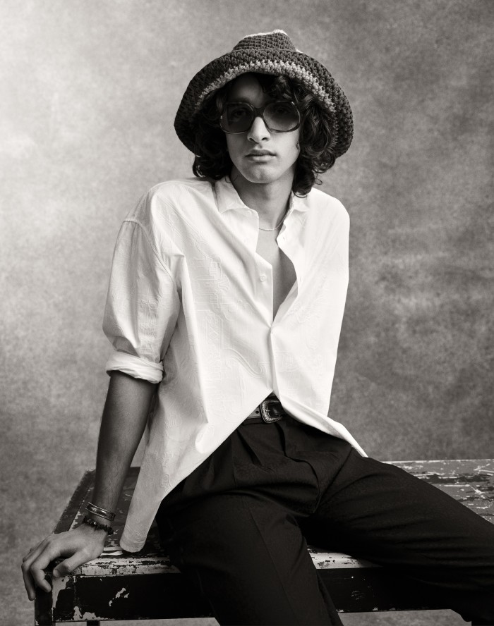 Noah wears Hermès cotton poplin shirt, £1,530. Saint Laurent by Anthony Vaccarello jacquard trousers, £925. Valette eco-responsible cotton crochet hat, £275. Port Tanger acetate sunglasses, £240